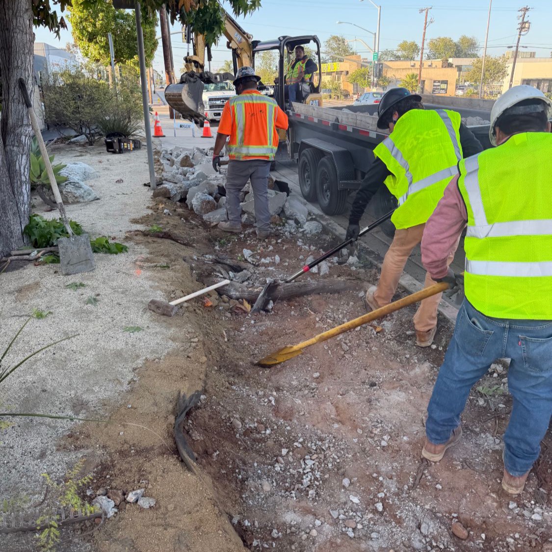 SD Sidewalks crew demolishing the old sidewalk on a San Diego street